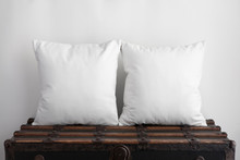 Mockup Of Two Large White Square Cushions Sitting On An Old Vintage Suitcase