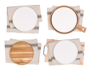 Wall Mural - White plates, cutting boards and tea towels isolated on white background, top view	