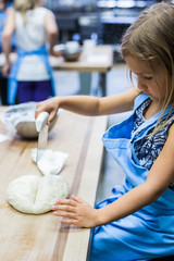 Wall Mural - Little Girl Making Pizza Dough