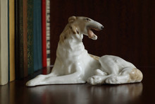 Porcelain Figurine Of A Dog Of Breed Russian Greyhound On A Bookshelf
