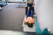 © Inti St. Clair - Woman does a physical therapy exercise