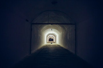 Wall Mural - Long corridor or illuminated tunnel in bomb shelter, underground military bunker of cold war, perspective