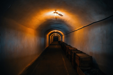 Wall Mural - Long corridor or illuminated tunnel in bomb shelter, underground military bunker of cold war, perspective