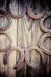 wedding rings with horseshoes on wood barn door