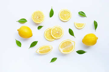 Lemon and slices with leaves isolated on white.