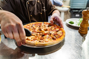 chef preparing pizza in the restaurant