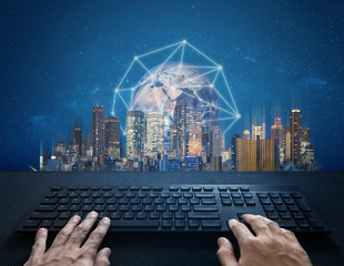 Poster - Internet, digital networking and connection. Hand typing computer keyboard and global network connection and the city. Element of this image are furnished by NASA