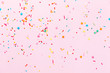 Easter Pink confetti and stars and sparkles on pink background. Top view, flat lay. Copyspace for text. Bright and festive holiday background.