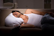 © Elnur - Young man suffering at home night time