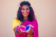 © yurakrasil - female indian model snow-white smile on holi color festival.Indian Woman in traditional sari dress with black curly hair in a pink and blue paint and bindi jewelry celebrating Holi color festival