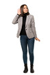 © luismolinero - A full-length shot of a Young business woman listening to something by putting hand on the ear over isolated white background