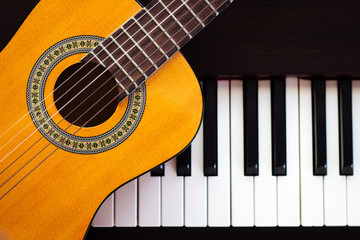 Guitar on piano. Classical music instrument.