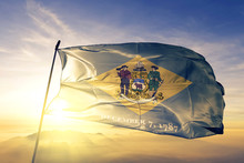 Delaware State Of United States Flag Waving On The Top Sunrise Mist Fog
