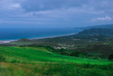 Fototapeta Na ścianę - Green Hills and Cloudy Mountains in the Barbados island, Caribbean