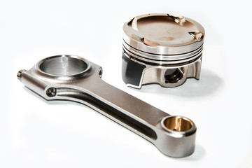 A picture of the light forged sport and racing piston and connecting rod. Isolated on white background. 