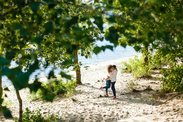 Wall Mural - Young happy couple on seashore