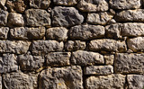 Fototapeta Desenie - old stone wall of stones