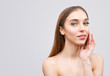 © proimagecontent - Young woman touching her face isolated on whire background