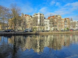 Wall Mural - Reflection of Amsterdam in city canal