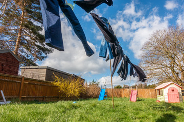 Wall Mural - Clothes drying outside on a washing line on a windy day