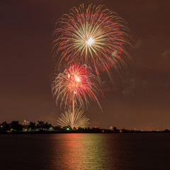 Fireworks Over A Lake - Colorful Fourth of July fireworks light up night sky over Marston Lake, Denver, Colorado, USA.