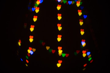 Colorful abstract heart shape blured bokeh at night