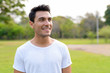© Ranta Images - Face of happy young handsome Hispanic man thinking at the park