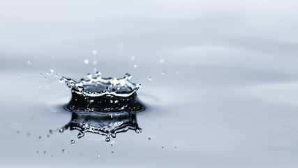 Water droplet splash background texture isolated on white. Fresh clean pure water ripples and splashes.