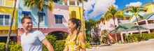 Summer Florida Vacation Couple Walking In City Street With Colorful Beach Houses Wooden Cottages At Fort Myers Beach Traditional Color House - Panoramic Banner.