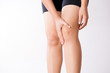 © Siam - Runner sport knee injury. Closeup young woman in knee pain while running. Healthcare and medical concept.