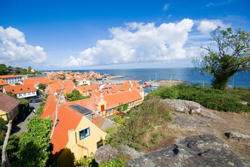 Wall Mural - Aerial view of small town - with beautiful, small houses - at the seaside, Gudhjem, Bornholm, Denmark