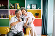 © Johnstocker - Elderly Couple Talking together and drinking coffee or milk