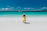 Fototapeta Łazienka - woman travel tropical beach resort with yacht view