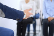© rogerphoto - Business man making presentation to group of people. Speaker delivering a seminar to his colleagues or business training. Teamwork and coaching concept