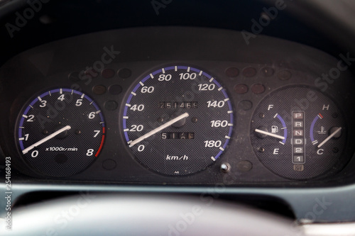 Close Up On Dashboard With Analog Devices Speedometer And