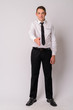 © Ranta Images - Full body shot of handsome businessman giving handshake