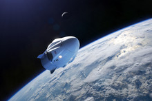 Cargo Spacecraft In Low-Earth Orbit. Elements Of This Image Furnished By NASA.