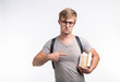 © satura_ - Reading, education, people concept - a young student man show you his books