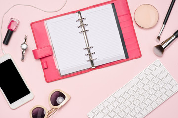 Sticker - Creative flat lay photo of workspace with cosmetics, coffee, smartphone, glasses,mascara,gloss with copy space on pink background