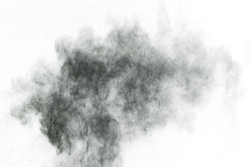 particles of charcoal on white background,abstract powder splatted on white background,Freeze motion of black powder exploding or throwing black powder.