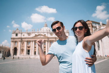 Happy couple at St. Peter's Basilica church in Vatican, Rome.