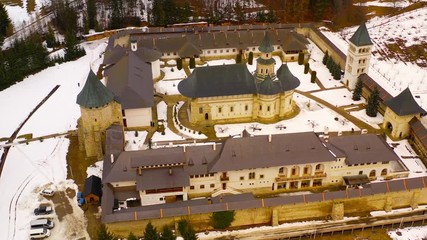 Wall Mural - Drone flying above Putna monastery. One of the most important romanian monastery, Putna. (Unesco Heritage). The monastery was built and dedicated by Stephen the Great