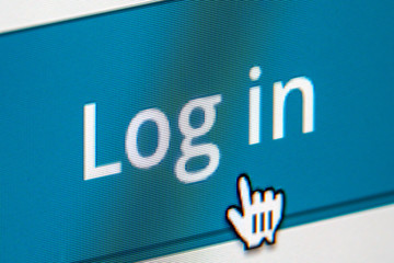 Wall Mural - Login button of a membership website being clicked. Close up of a computer screen.