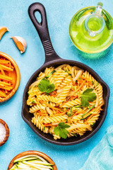 Fusilli pasta with squid, zucchini and carrots