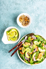 Wall Mural - Healthy avocado salad with chicken breast and spinach, flat lay, top view