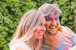 © satura_ - Festival of holi and technology concept - young couple making selfie at the festival