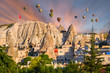 Beautiful rocks and hot air balloons at sunset in city  Goreme, Cappadocia, Turkey