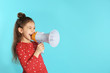 © New Africa - Cute funny girl with megaphone on color background. Space for text