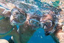 Snorkeling Friends Posing Underwater In Sea Water