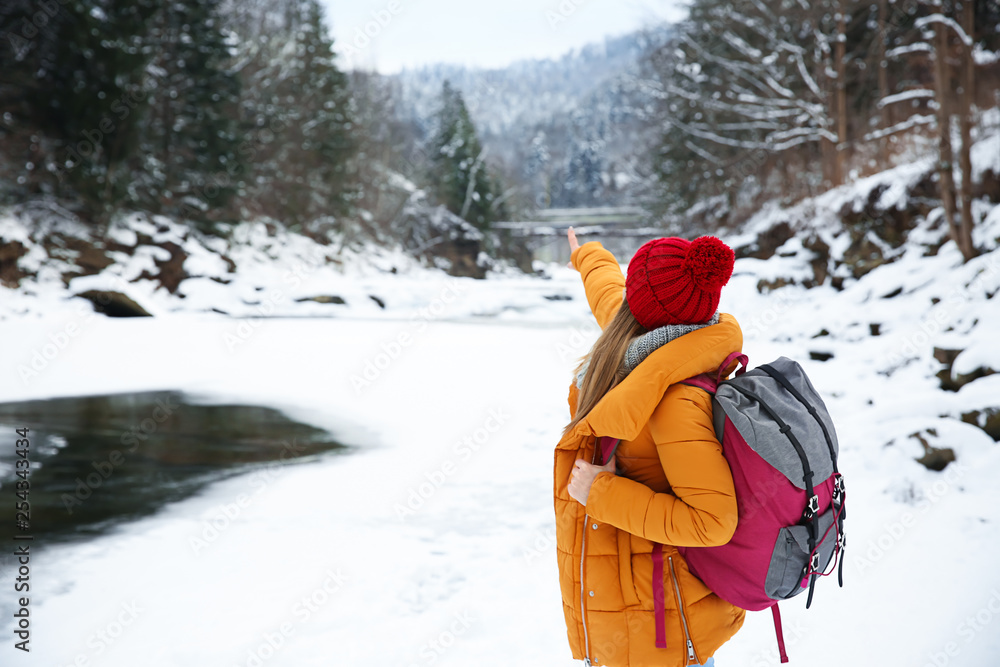 Beautiful woman at snowy resort